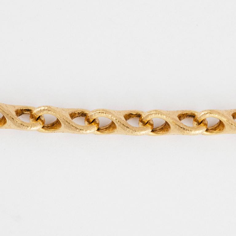 HALSSMYCKE, Ole  Lynggaard, 18k guld med briljantslipad diamant ca0,07ct. Totalvikt 43,5g.