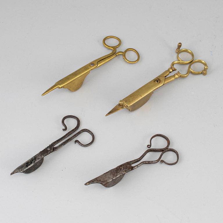 Four 18th century bronze and iron candle snuffers.