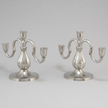A pair of pewter candelabra from GAB Tenn, Stockholm, 1935.