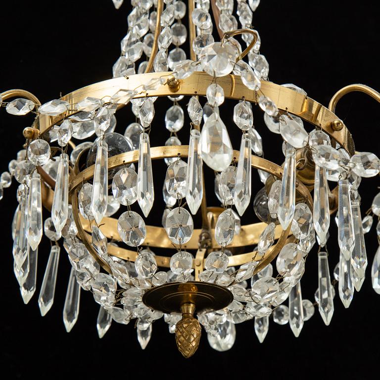 A small Swedish 20th century empire style chandelier for three candles.