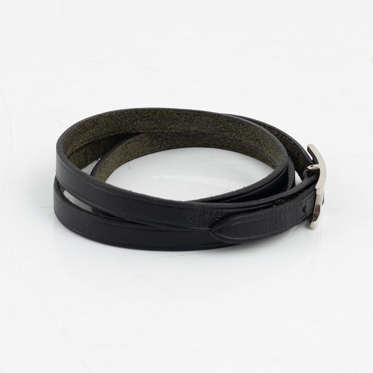 Hermès, a black leather 'Behapi' bracelet.