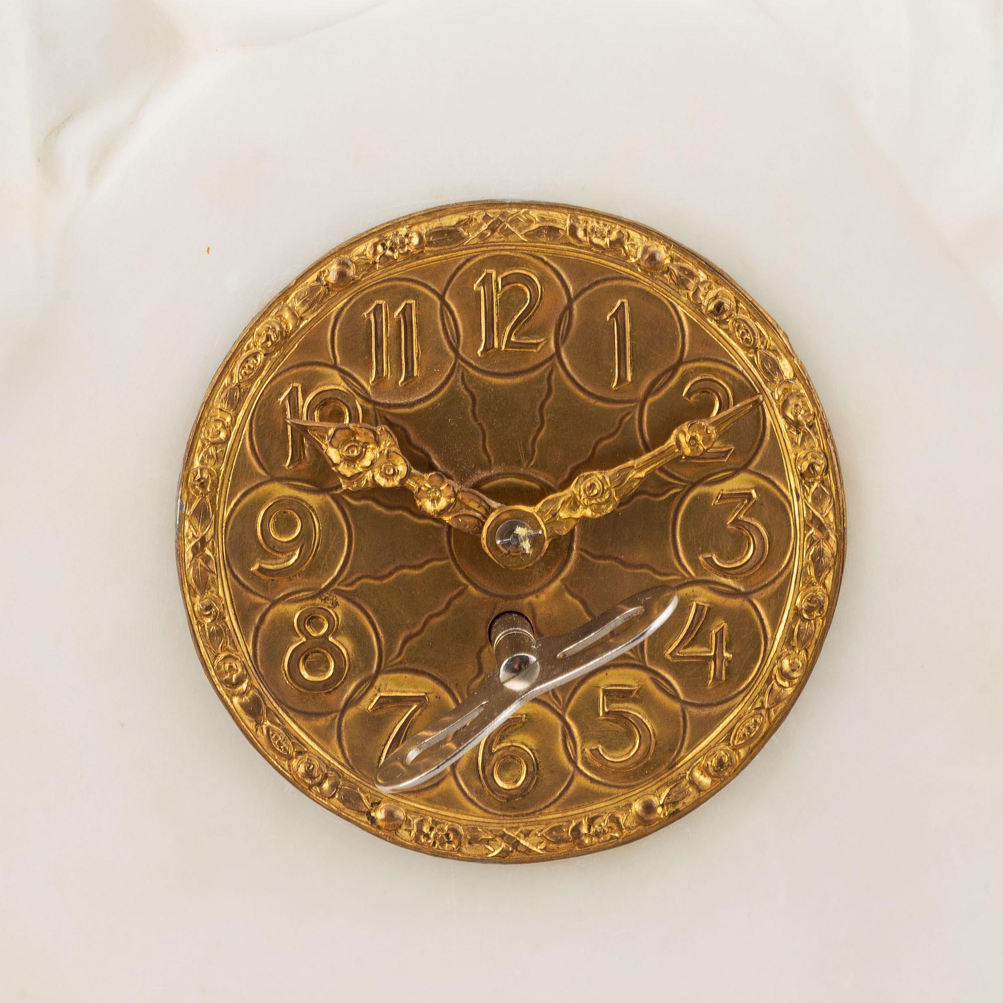An alabaster mantle clock from the second half of the 19th-century.