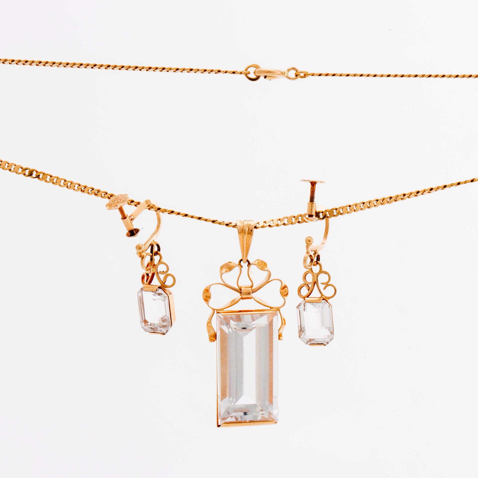 STIGBERT chainn and pendant and earrings, 18l gold and rock crystal.