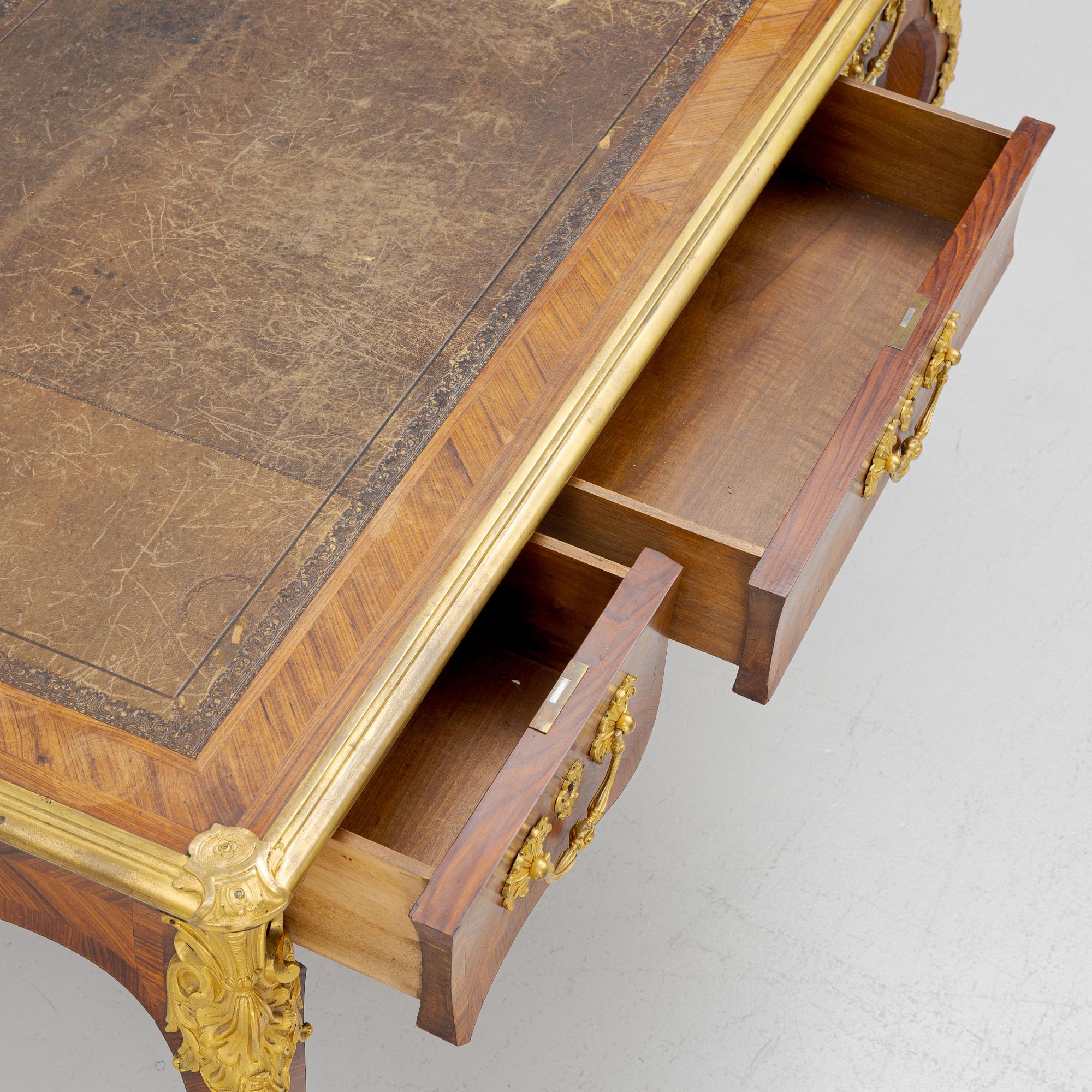 A French Napoleon III Louis XV-style parquetry and gilt bronze-mounted desk, second half of the 19th century.