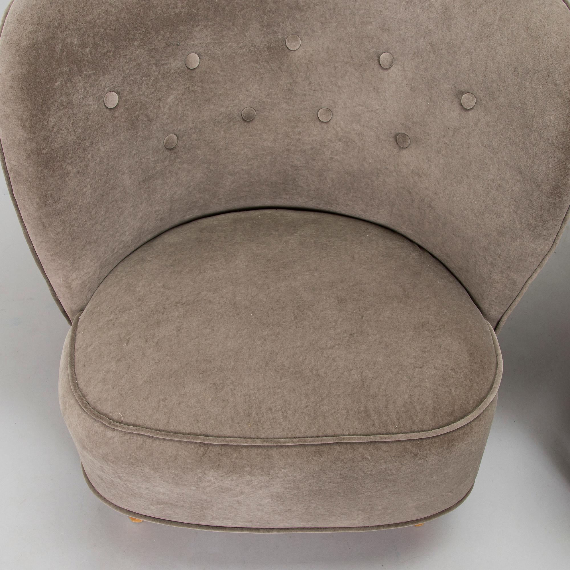 A pair of mid 20th century armchairs.