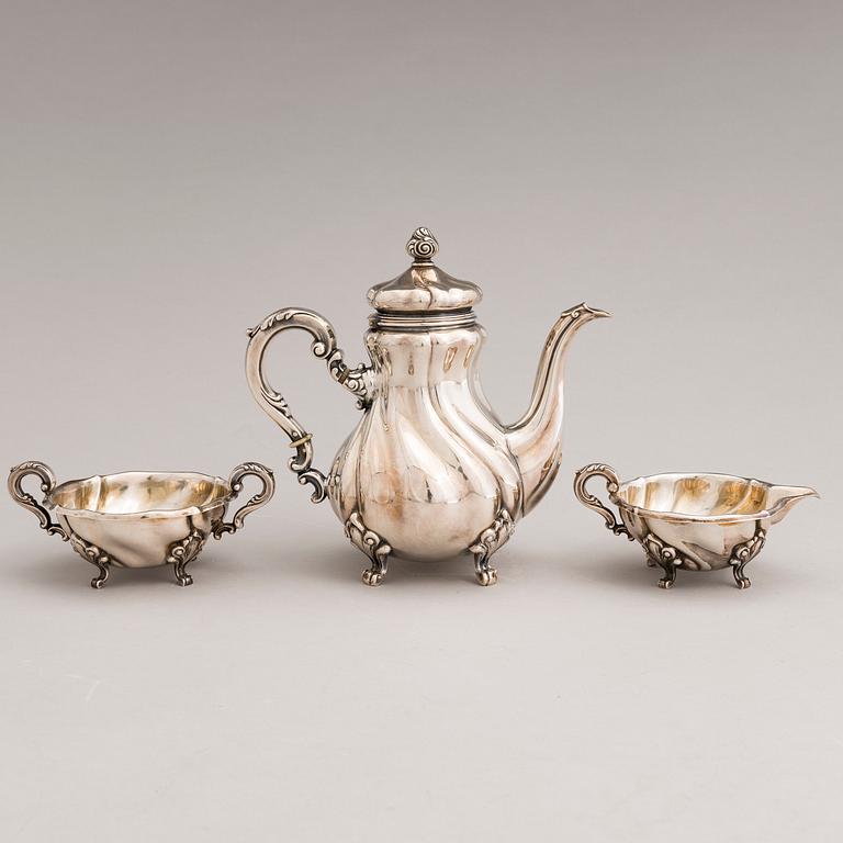 A silver sugar tong and a 3-piece silver coffee set, mark of Juho H. Pekuri, Oulu 1931 and Finnish import marks 1938.