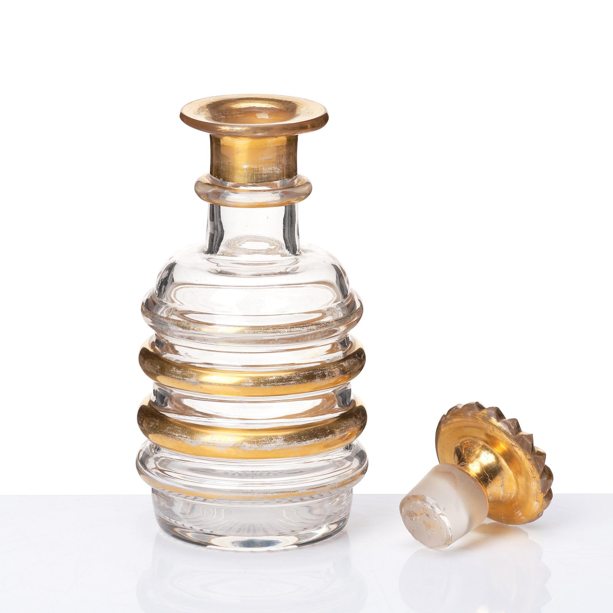 A set of Russian glasses (13 pcs.) and a bottle with stopper, 19th Century.