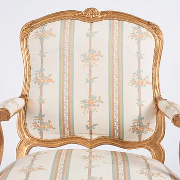 A Rococo armchair 18th century, (one later copy will follow the lot).
