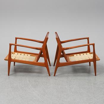 A pair of late 20th Century easy chairs.