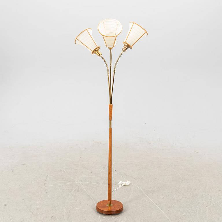 A brass and teak floorlamp from the mid 1900's.