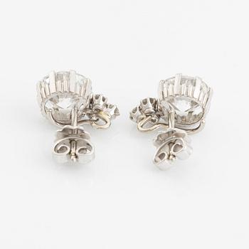 A pair of 18K white gold earrings set with two round brilliant-cut diamonds, probably made by WA Bolin.