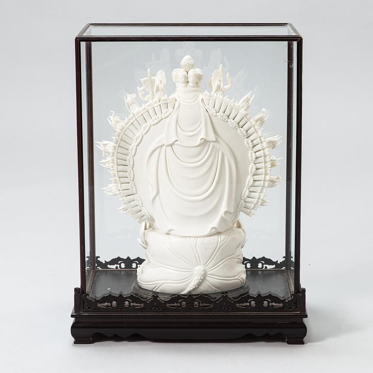 An oriental Buddha statue in porcelain.