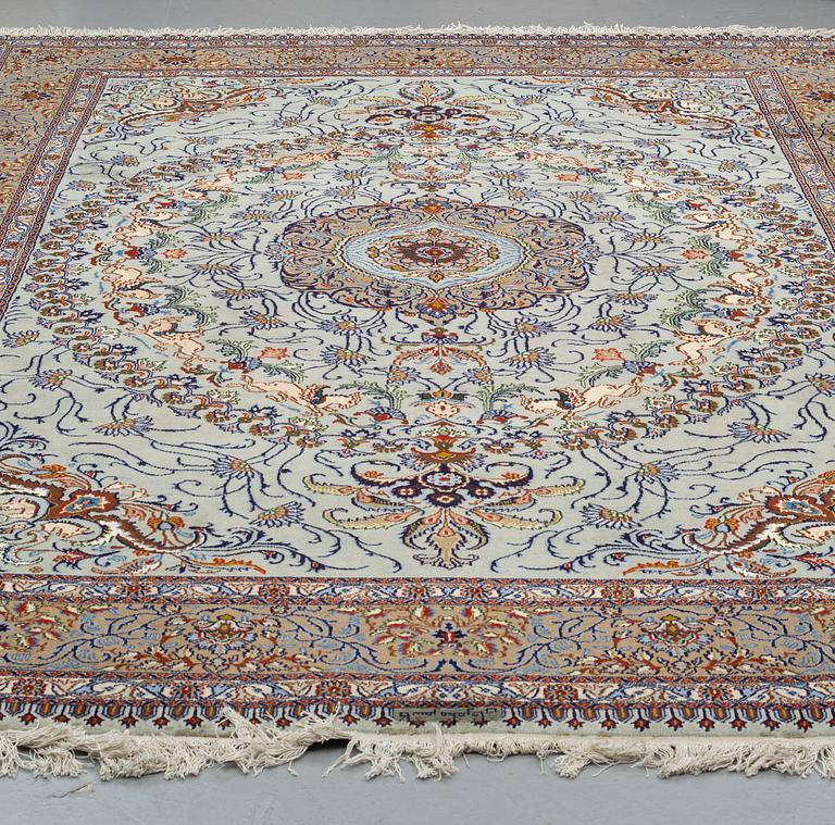 A CARPET, Kashmar, part silk, signed Mosafar Khan, around 344 X 241.