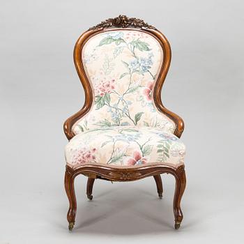 A late 19th century armchair in Rococo style.