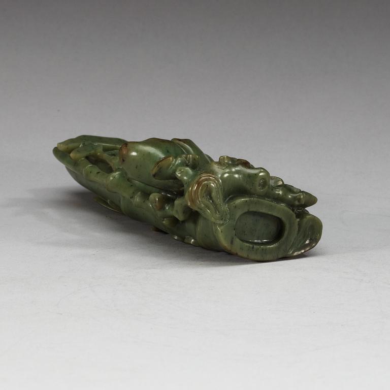 A  carved green stone sculpture, late Qing dynasty.
