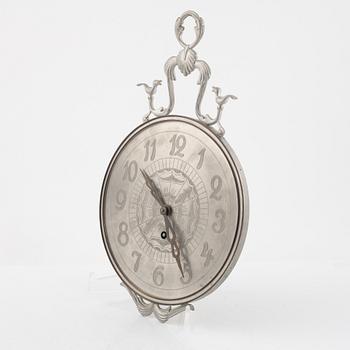 Nils Fougstedt, a pewter and brass wall clock, Svenskt Tenn, Stockholm 1935, model "A 618".