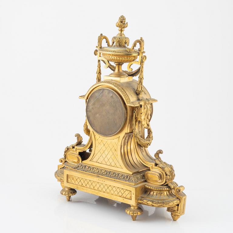A Louis XVI-style gilt bronze mantel clock, 19th Century.