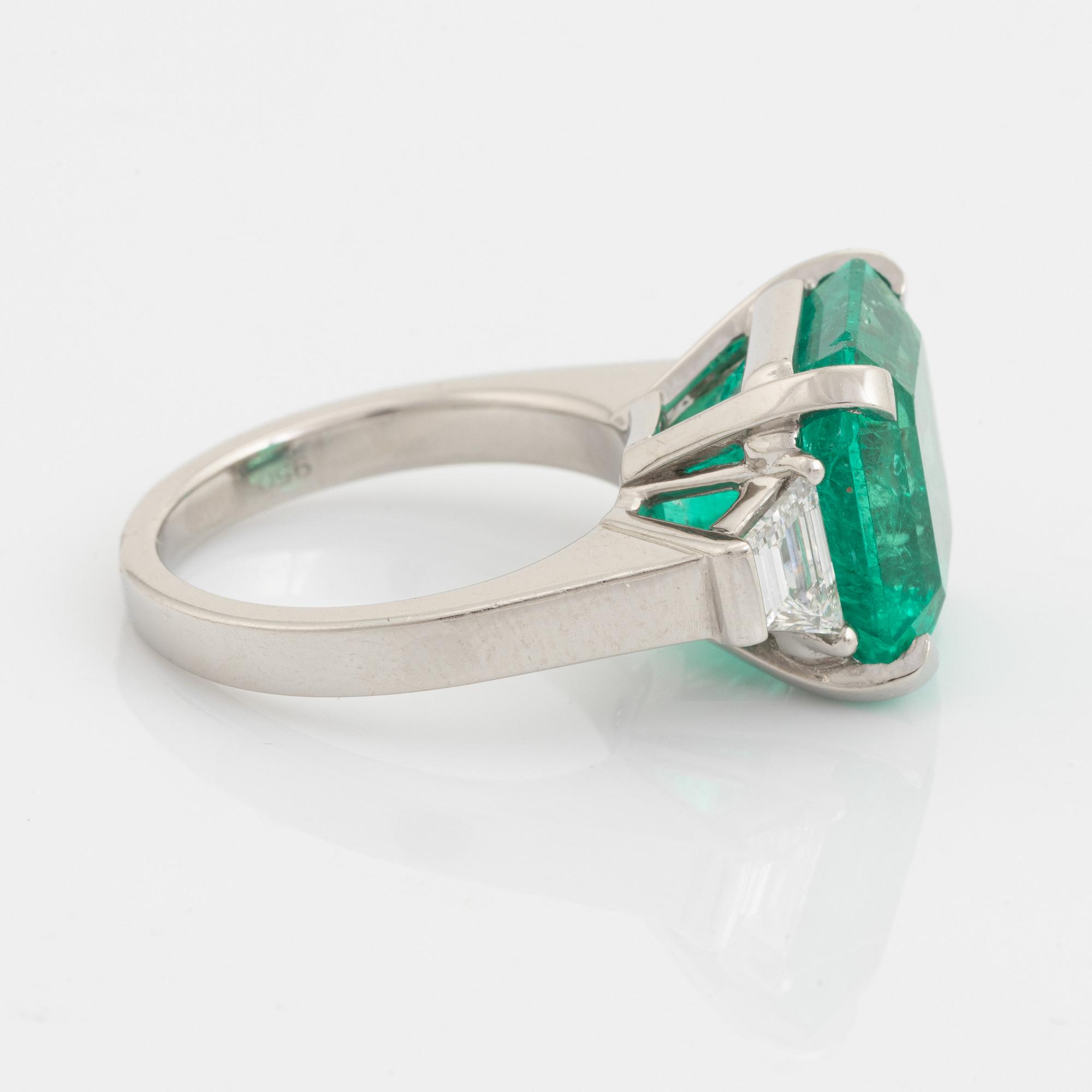 Emerald and trapezoid cut diamond ring.