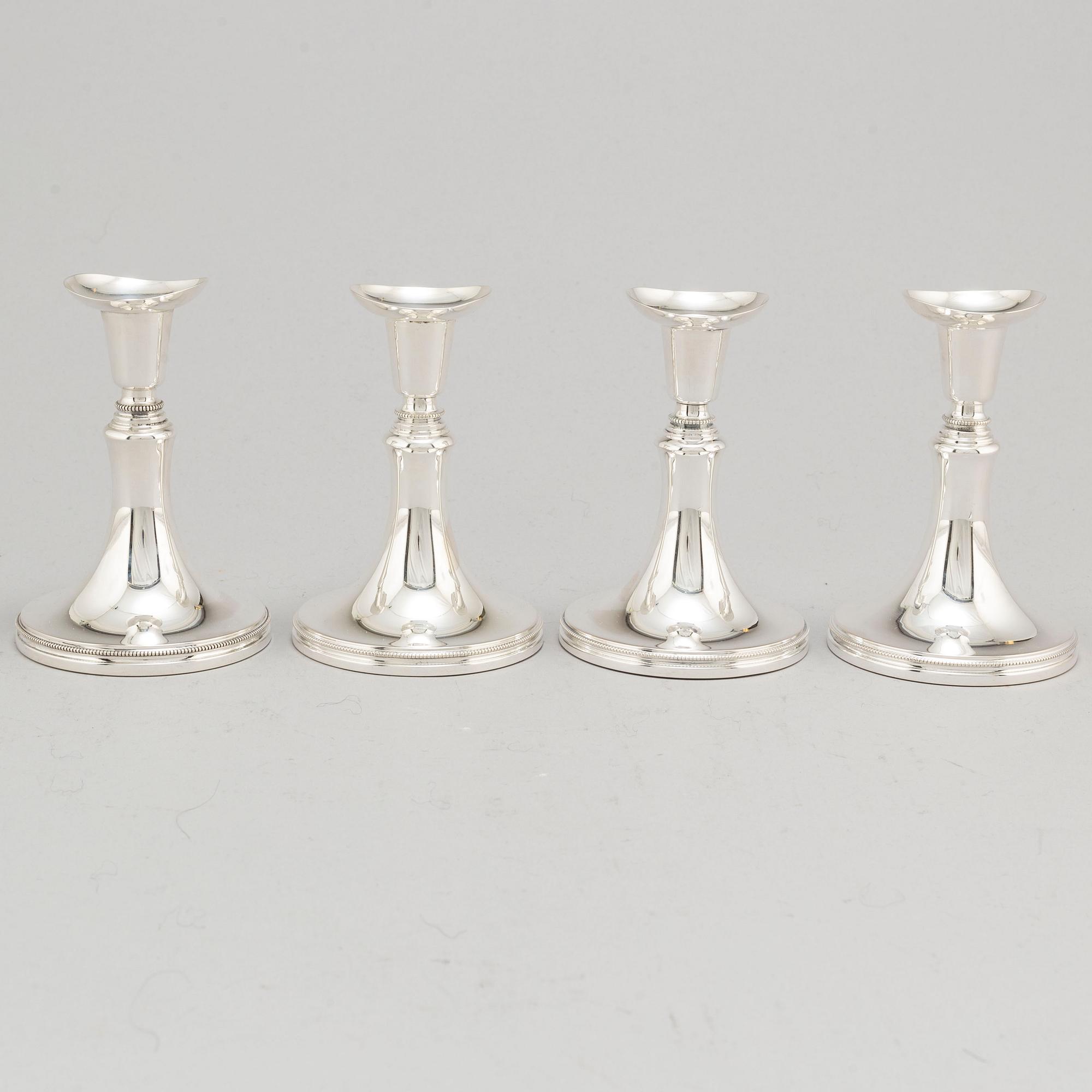 A set of four Swedish silver candlesticks, maker's mark Erik Löfman, Uppsala 1971-1973.
