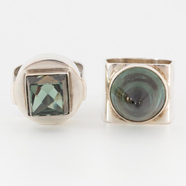 Silver and synthetic green spinel rings.