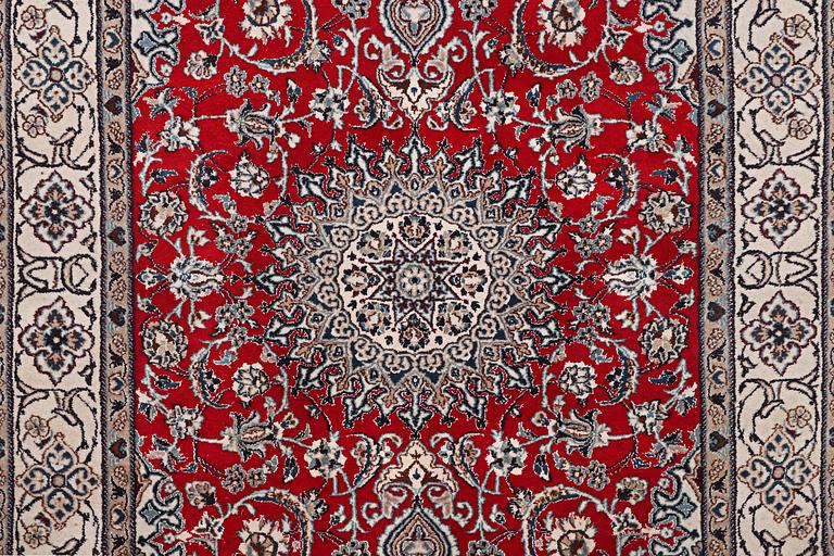 A carpet, Nain, part silk, 9 laa, ca. 303 x 198 cm.