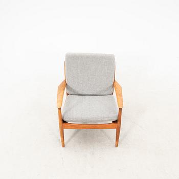 A Grete Jalk teak armchair and sofa from Glostrup Denmark, 1960s, marked.