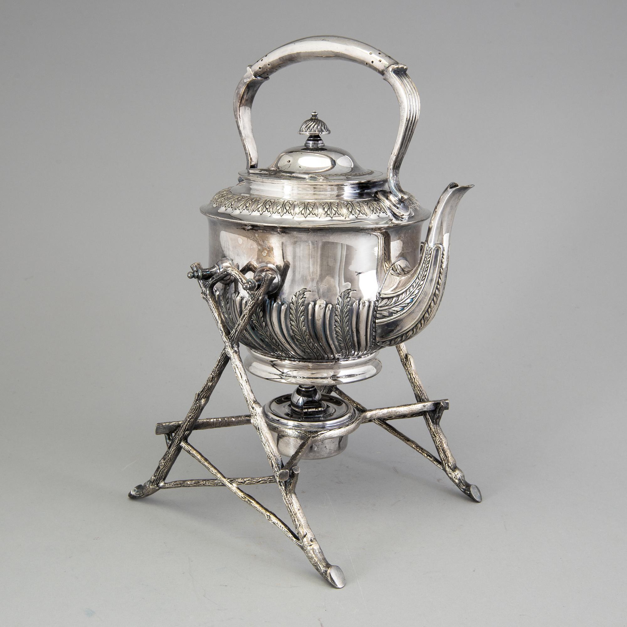 A 20th century tea pot on stand by Walker & Hall, Sheffield, England.