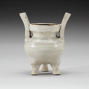 A pale grey-bluish glazed tripod censer with decor in relief, and archaistic mark, Ming dynasty (1368-1644).