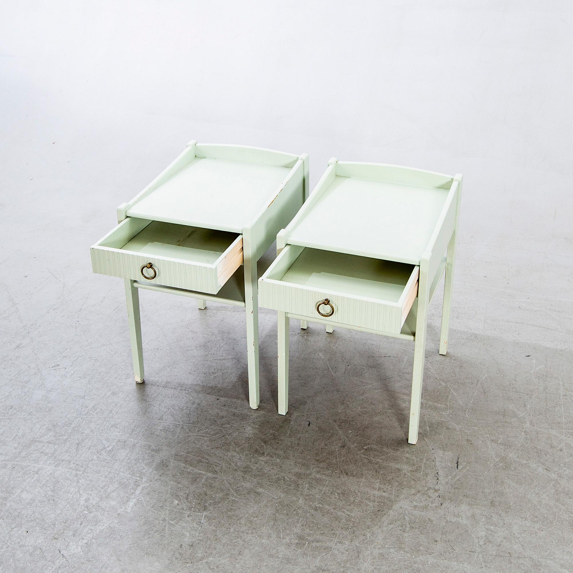 A pair of 1950/60s bedside tables.