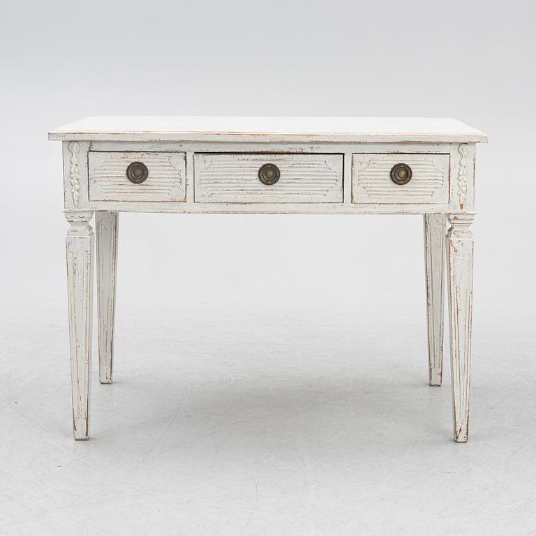 A late 19th century desk and an "Odenslunda" chair from IKEAs 18th century series.