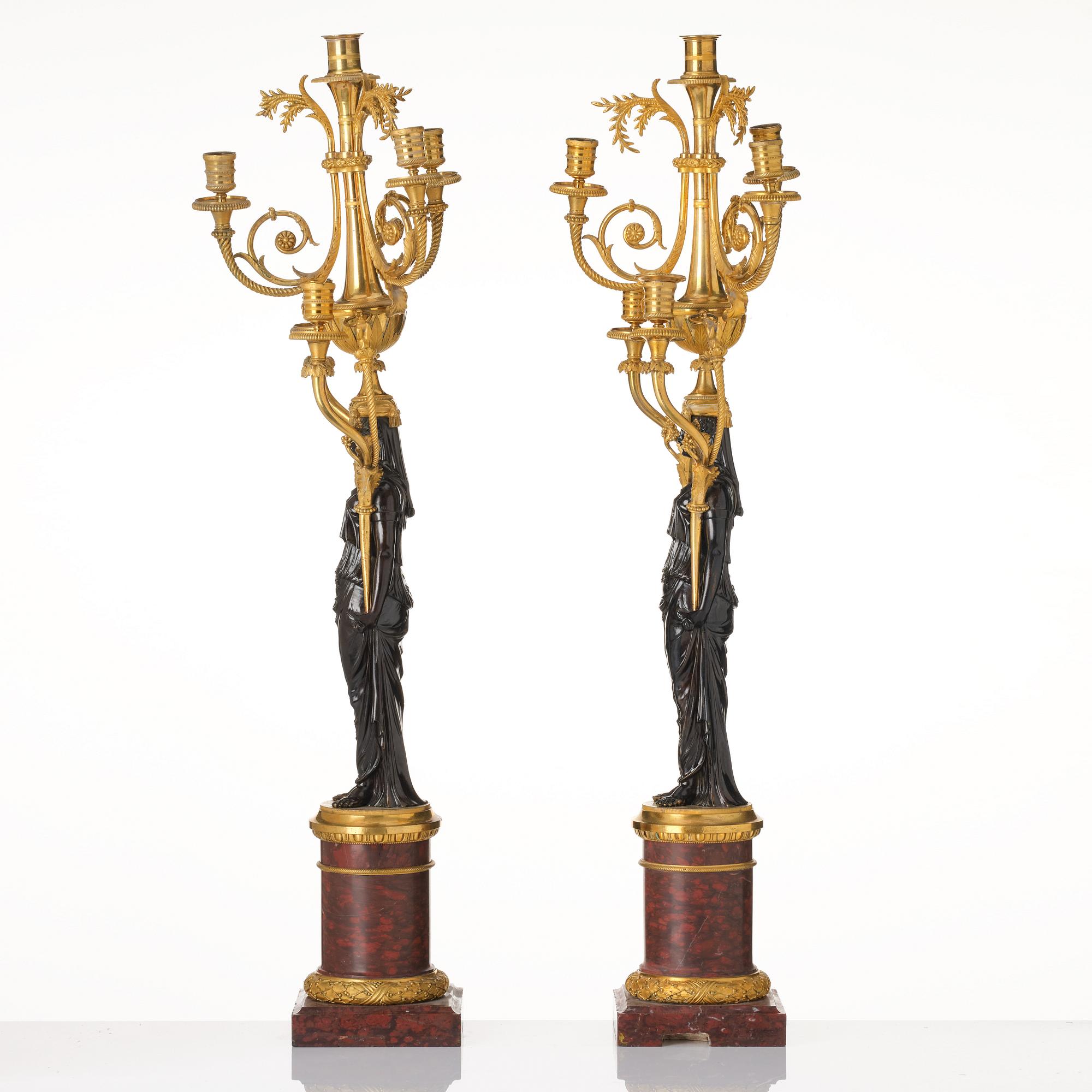 A pair of Louis XVI ormolu and patinated bronze six-branch candelabra attributed to François Rémond, late 18th century.