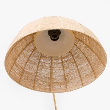 A mid-20th century wall light for Valinte, Finland.