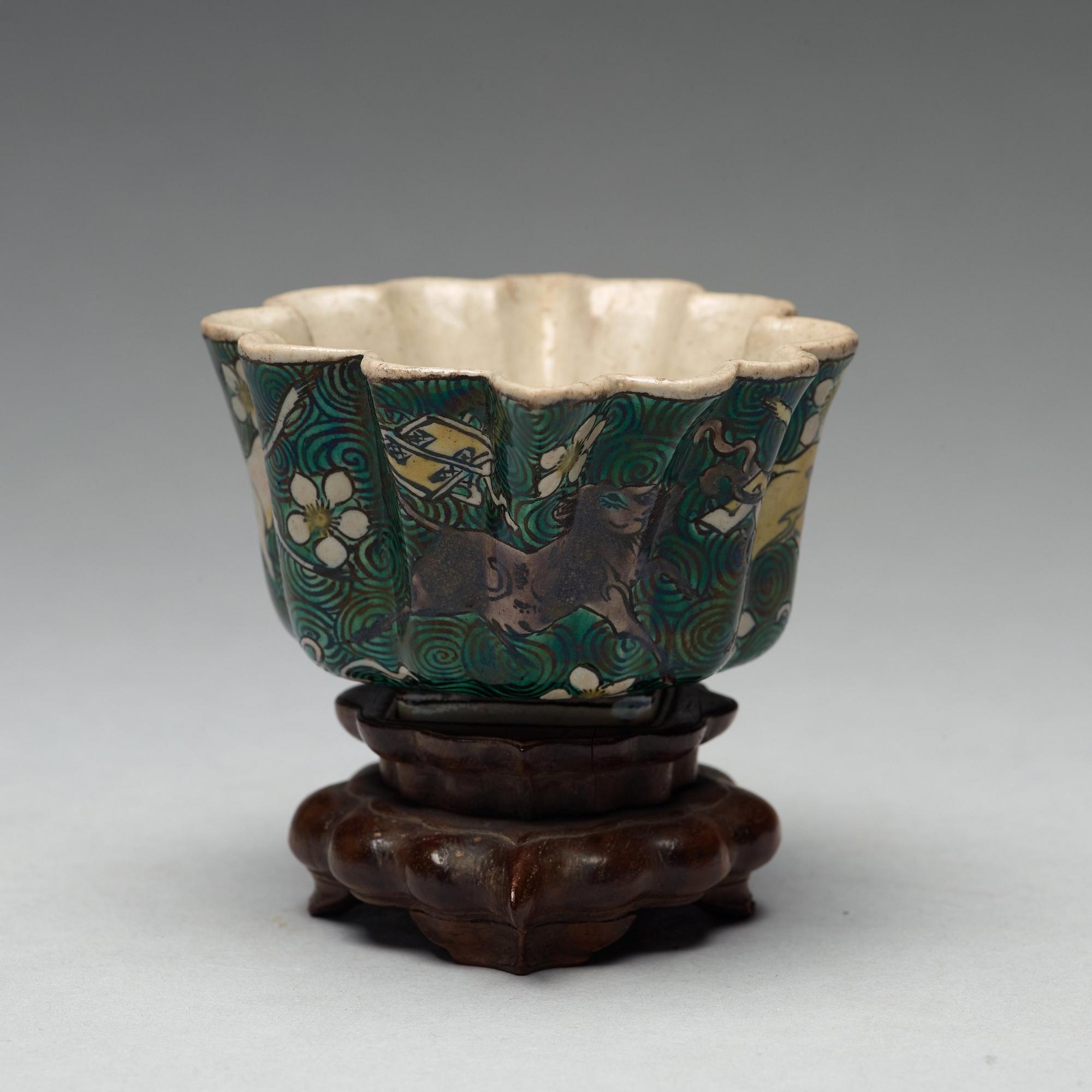 A famille verte bisquit cup, Qing dynasty, 17th century.