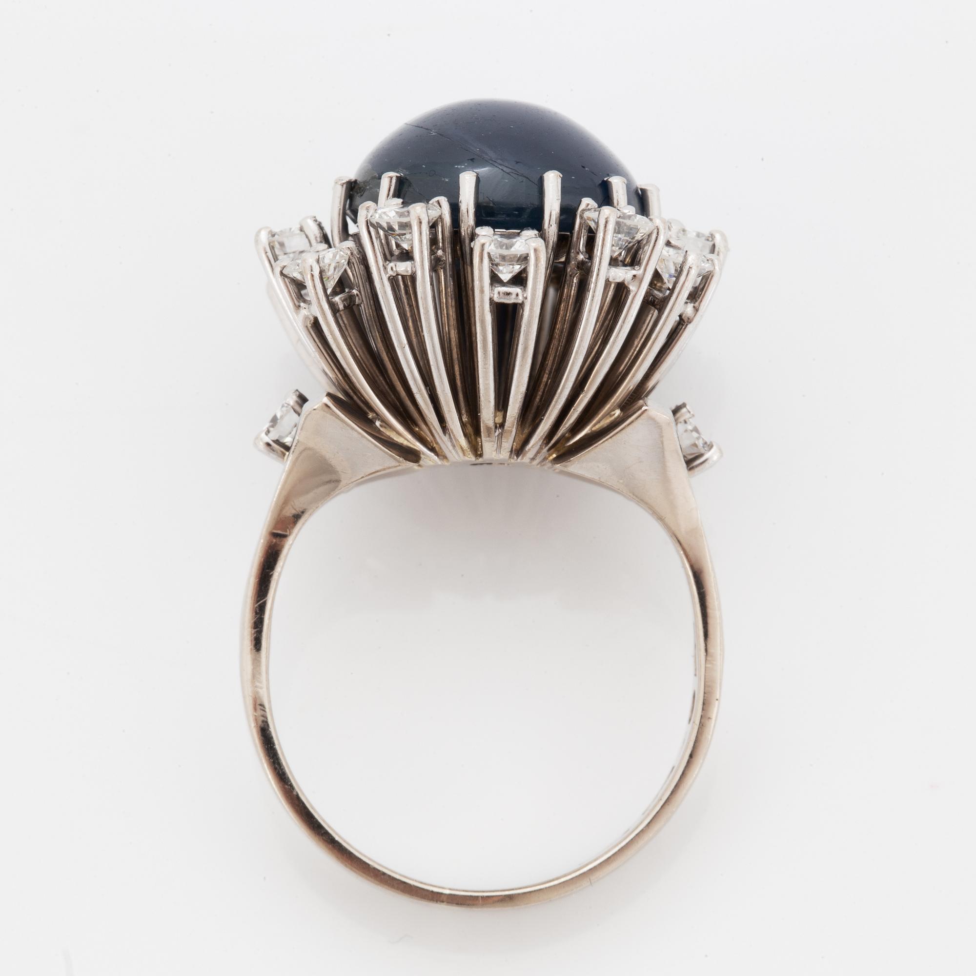 Cabochon-cut sapphire and brilliant-cut diamond cocktail ring.