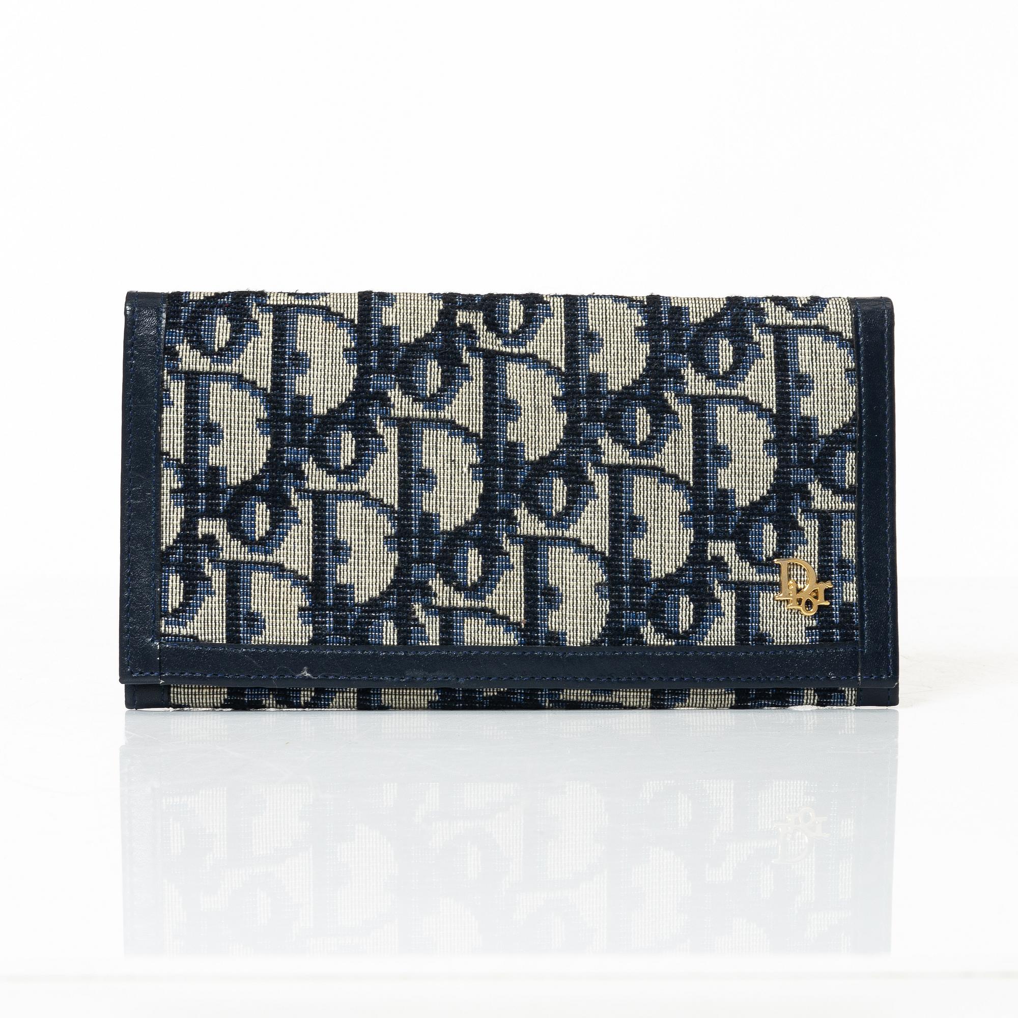 Christian Dior, a wallet.