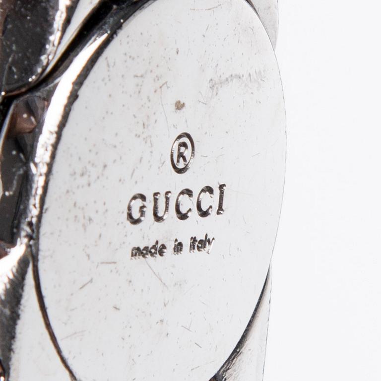 LAUKKU, Gucci.