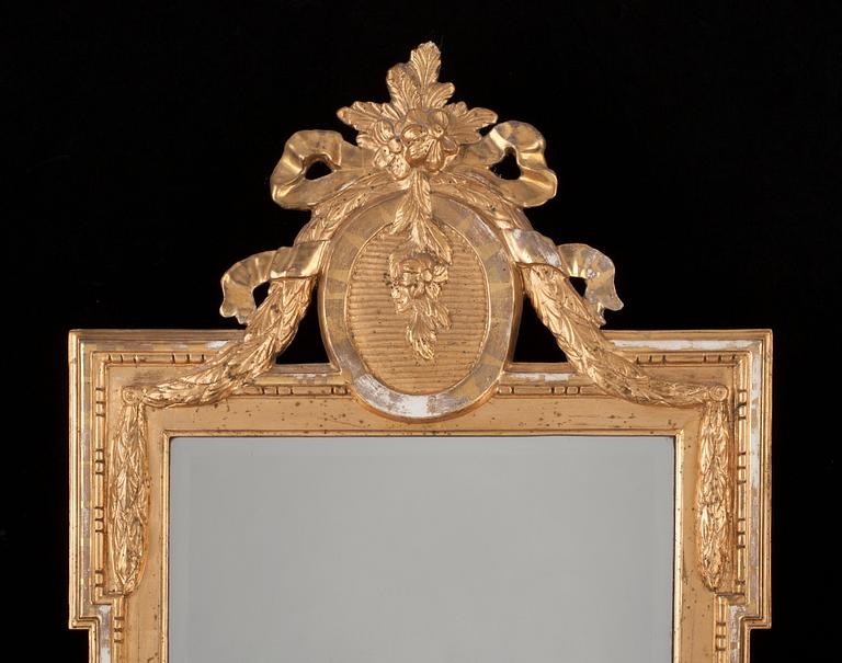 A Gustavian mirror dated 1777.