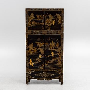 A Chinese lacquered two-part cabinet, first part of the 20th century.