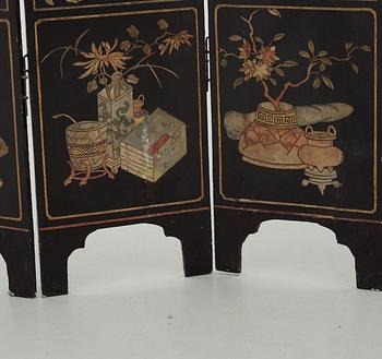 An eight panel lacquer screen, Qing dynasty, presumably Kangxi (1662-1722).