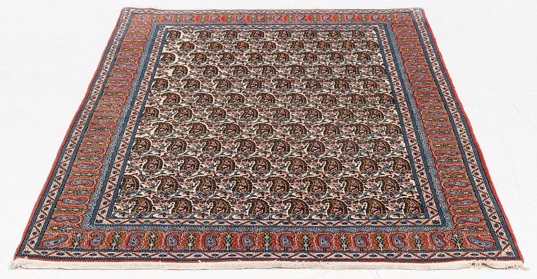 An oriental rug, c. 207 x 138 cm.