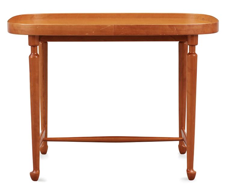 A Josef Frank mahogany table by Svenskt Tenn.