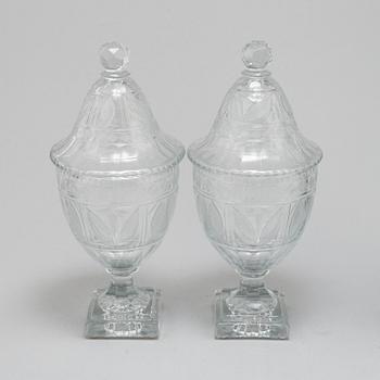 A pair of late 19th century lidded glass cups.