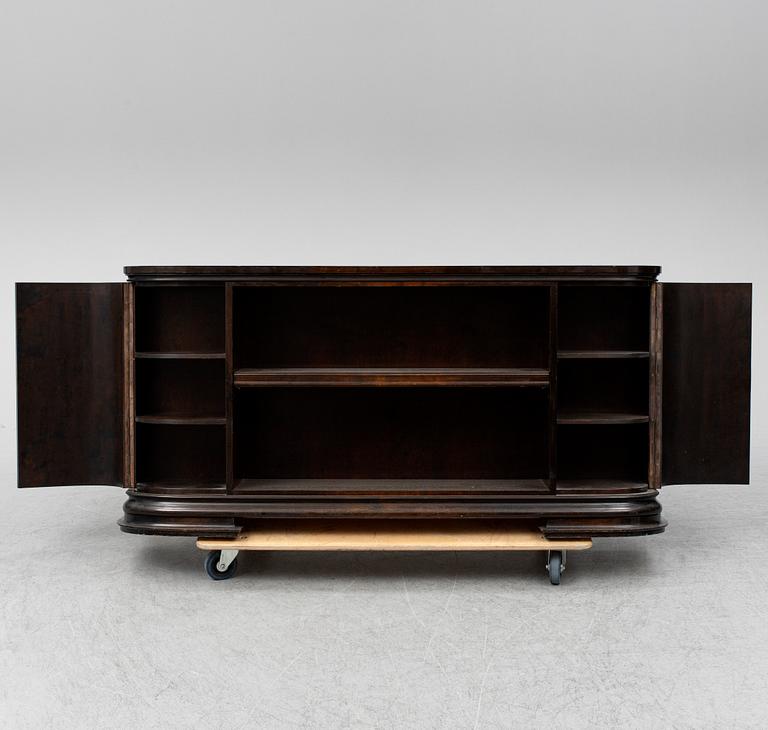 A 1930s stained birch shelf.