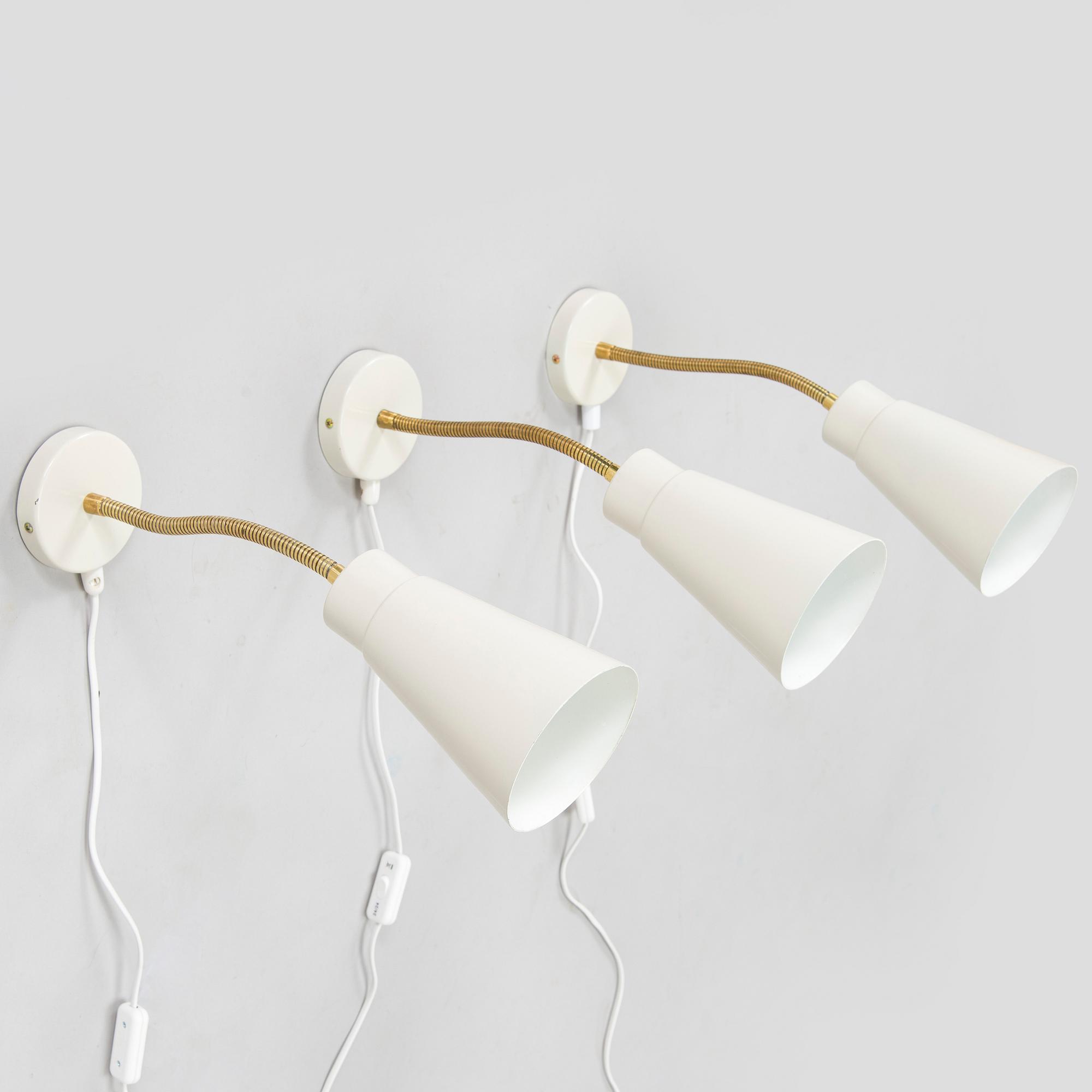 A set of three mid-20th century wall lights, model AH6, for Itsu Finland.