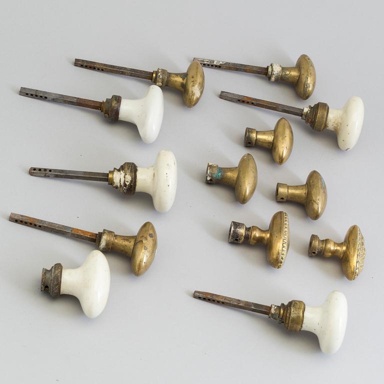 13 BRONZE AND PORCELAIN DOOR KNOBS, 19th century.