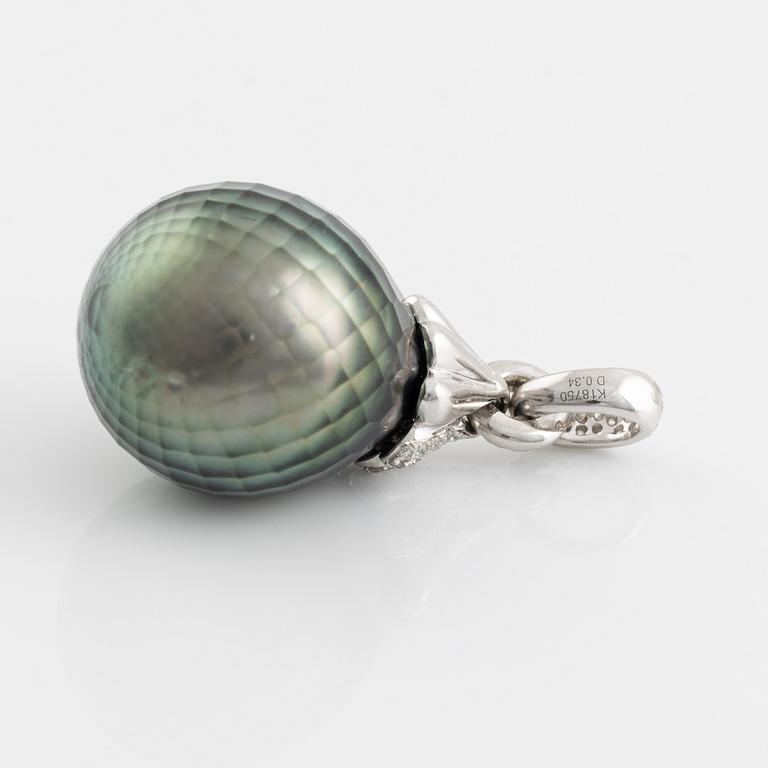 Carved cultured Tahiti pearl and brilliant cut diamond pendant.