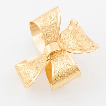 Brooch, 18K gold in the form of a bowknot.
