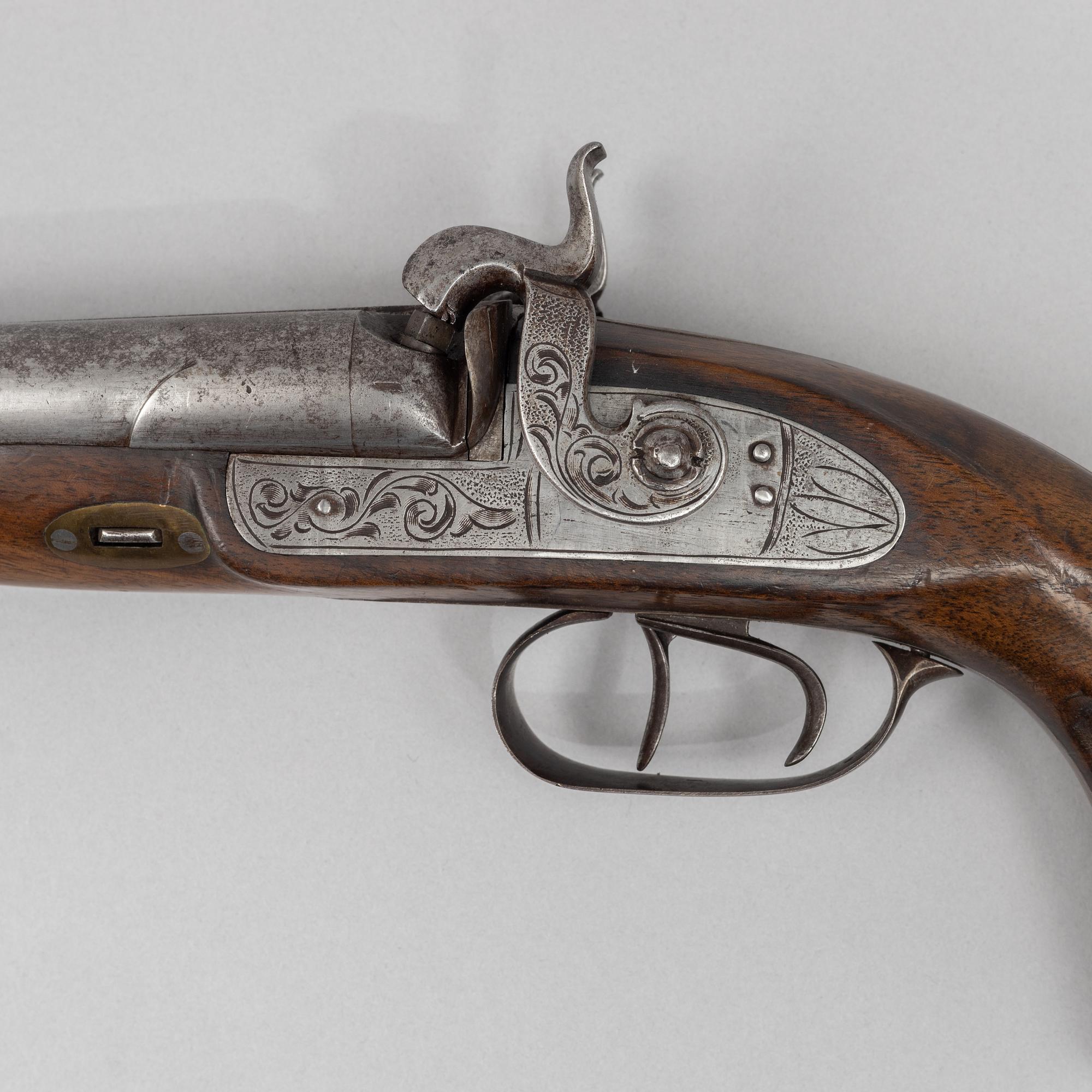 A double-barrelled percussion pistol, second half of the 19th century.