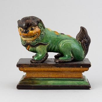 A green and yellow glazed buddhist lion, Qing dynasty, 19th Century.