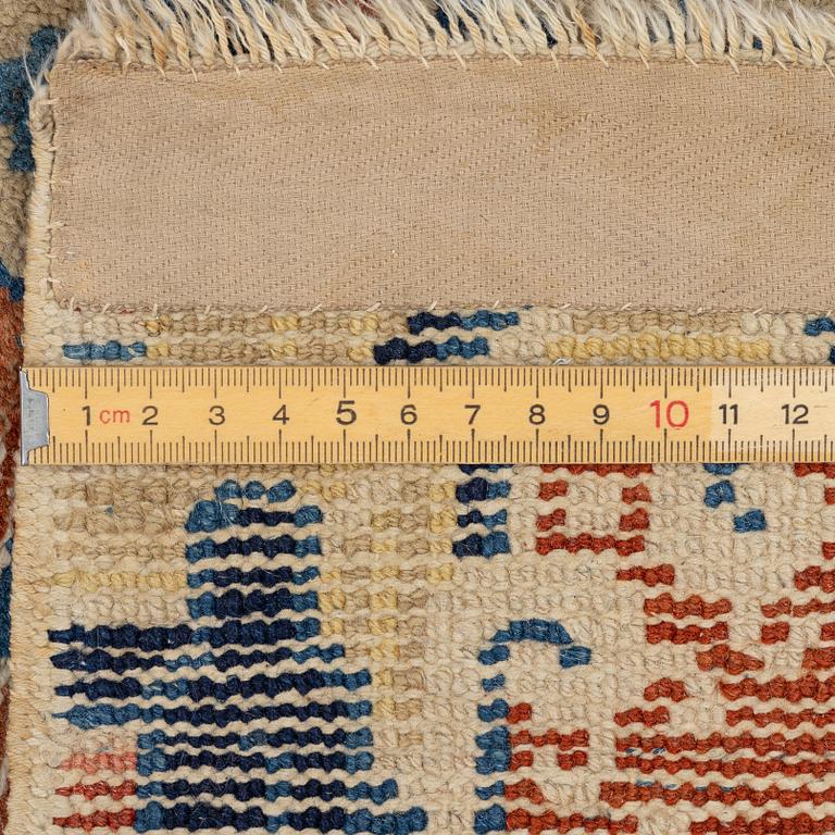 Two Chinese carpet fragments, late Qing dynasty.